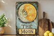 a painting of a moon with a woman's face on it