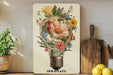 a picture of a light bulb with flowers in it
