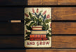 a sign that says learn and grow on a wooden bench