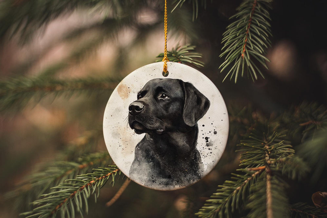a black dog ornament hanging from a christmas tree
