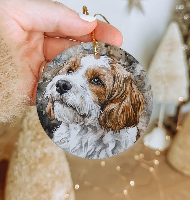 a person holding a dog ornament in their hand