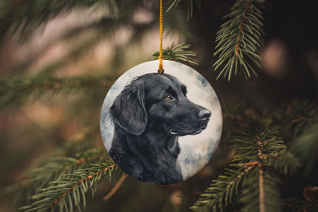 a black dog ornament hanging from a christmas tree