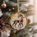 a wooden ornament hanging from a christmas tree