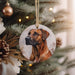 a brown dog ornament hanging from a christmas tree