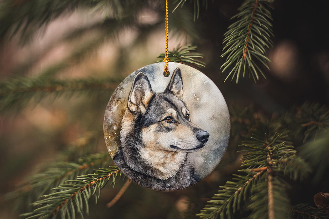 a wolf ornament hanging from a christmas tree