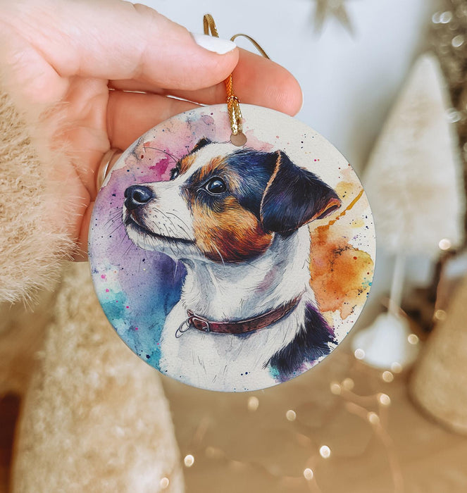 a person holding a dog ornament in their hand