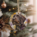 a dog ornament hanging from a christmas tree