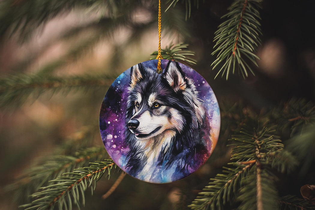 a wolf ornament hanging from a christmas tree
