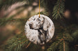 a dog ornament hanging from a christmas tree