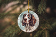 a dog ornament hanging from a christmas tree