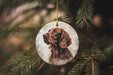 a brown dog ornament hanging from a christmas tree