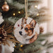 a dog ornament hanging from a christmas tree