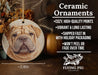 a ceramic ornament with a dog's face on it