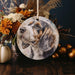 a ceramic ornament with a picture of a dog on it