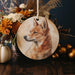a ceramic ornament with a picture of a dog on it