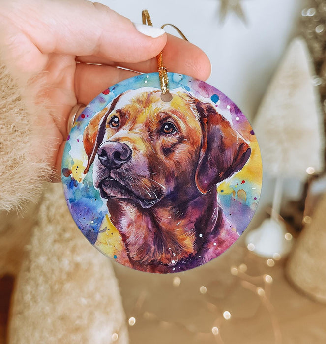 a hand holding a round ornament with a picture of a dog on it