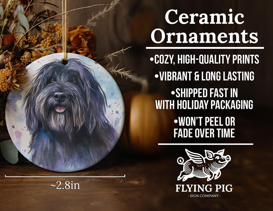 a ceramic ornament with a black dog on it