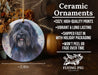 a ceramic ornament with a black dog on it
