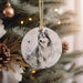 a christmas ornament with a picture of a wolf on it