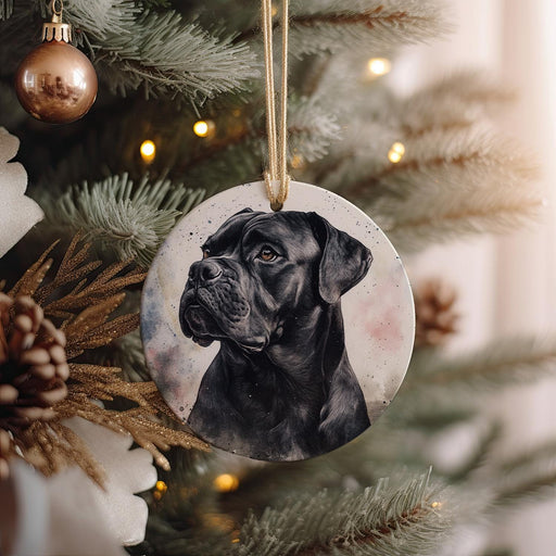 a black dog ornament hanging from a christmas tree