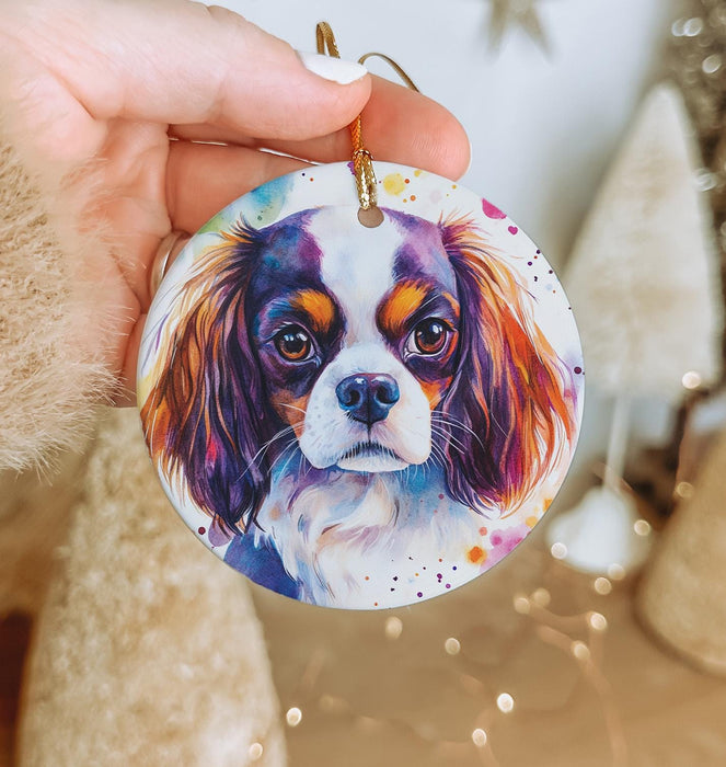 a person holding a dog ornament in their hand