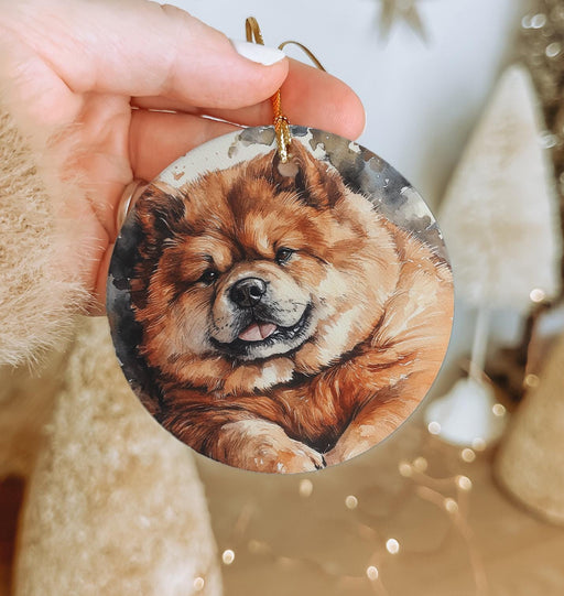 a person holding a dog ornament in their hand