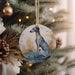 a ceramic ornament hanging from a christmas tree