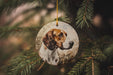 a dog ornament hanging from a christmas tree