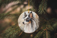 a ceramic ornament with a dog's face on it