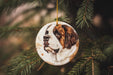 a dog ornament hanging from a christmas tree