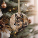 a picture of a wolf ornament hanging from a christmas tree