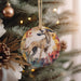 a dog ornament hanging from a christmas tree