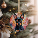 a dog ornament hanging from a christmas tree
