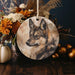a ceramic ornament with a picture of a wolf on it