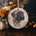 a ceramic ornament with a picture of a dog on it