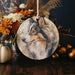 a ceramic ornament with a picture of a dog on it