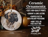 a ceramic ornament with a picture of a dog on it