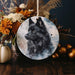 a ceramic ornament with a picture of a wolf on it