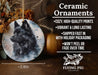 a ceramic ornament with a black dog on it