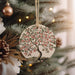 a tree ornament hanging from a christmas tree