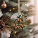 a close up of a christmas tree with ornaments