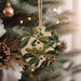 a christmas ornament hanging from a christmas tree