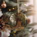 a christmas ornament hanging from a christmas tree