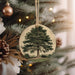 a christmas ornament hanging from a christmas tree