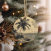 a christmas ornament hanging from a christmas tree