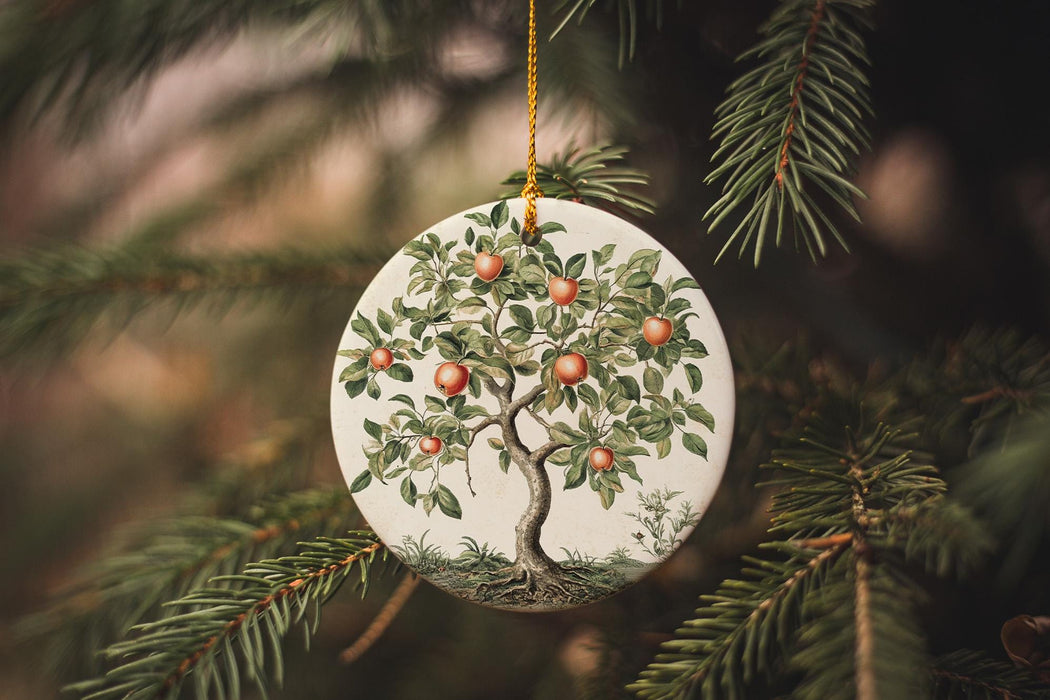 a ceramic ornament hanging from a christmas tree