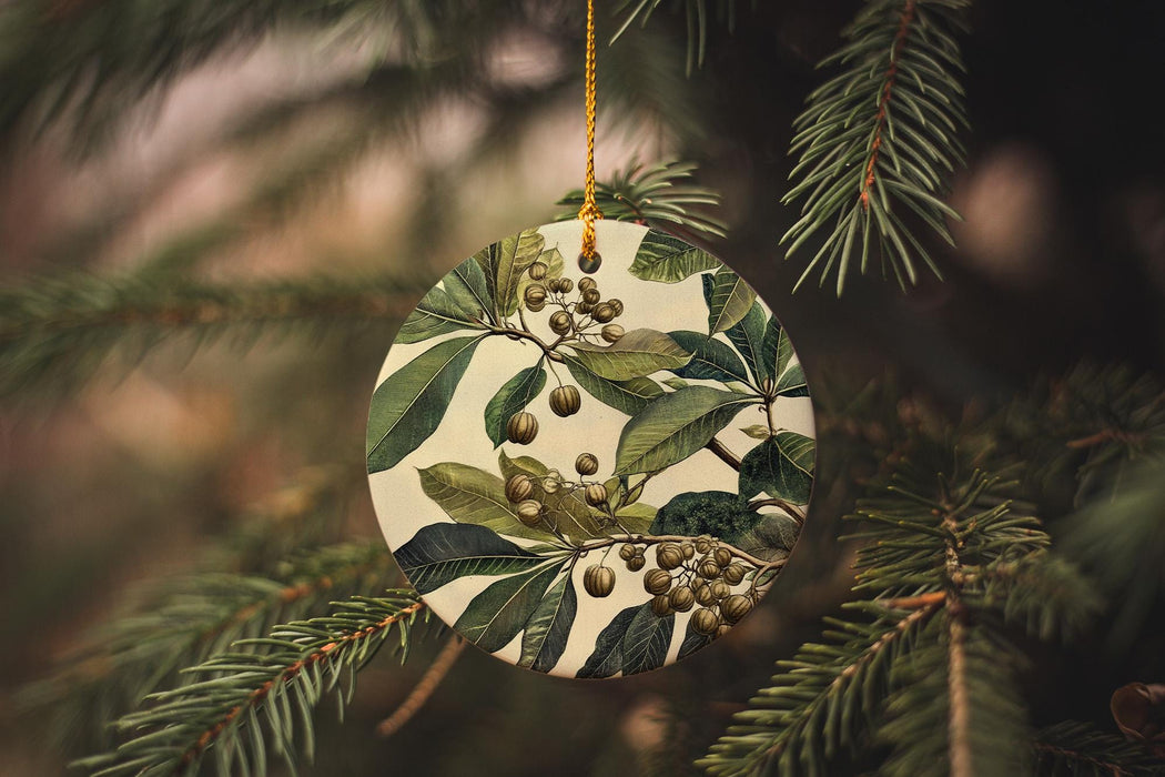 a ceramic ornament hanging from a christmas tree