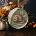 a plate with a picture of a snail on it