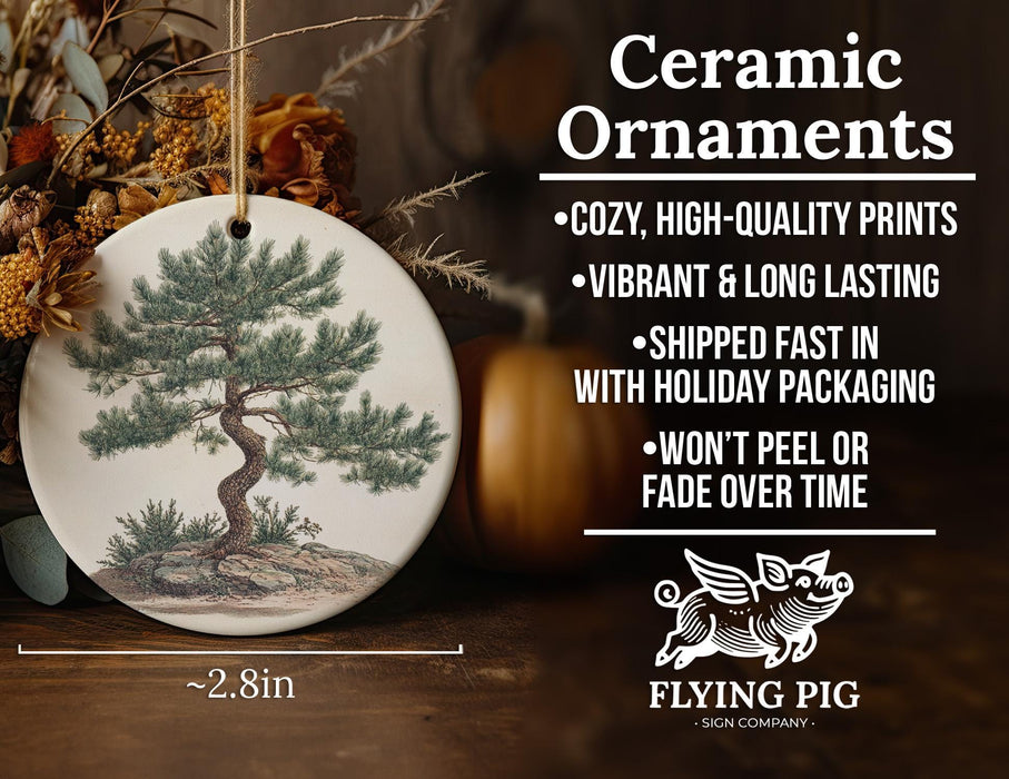 a ceramic ornament with a tree on it