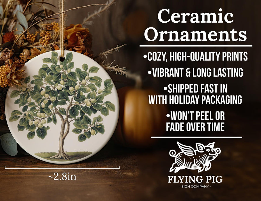a ceramic ornament with a tree on it